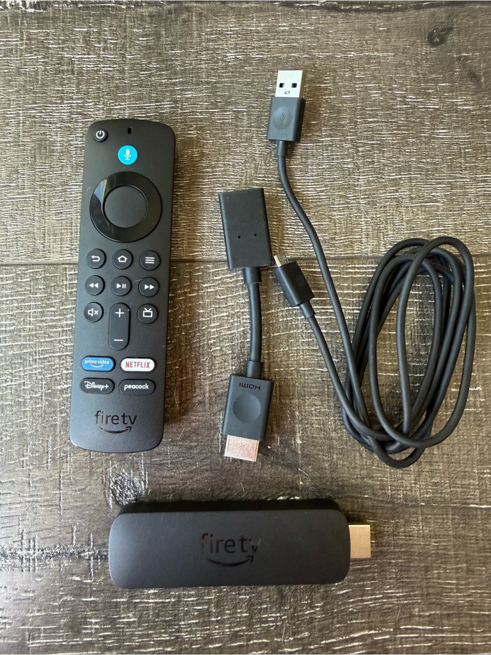Amazon Fire TV Stick - Includes Remote, HDMI Extender, & USB Cable